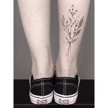 Hand-poked wildflower bouquet tattoo