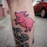 Happy jumping pig tattoo