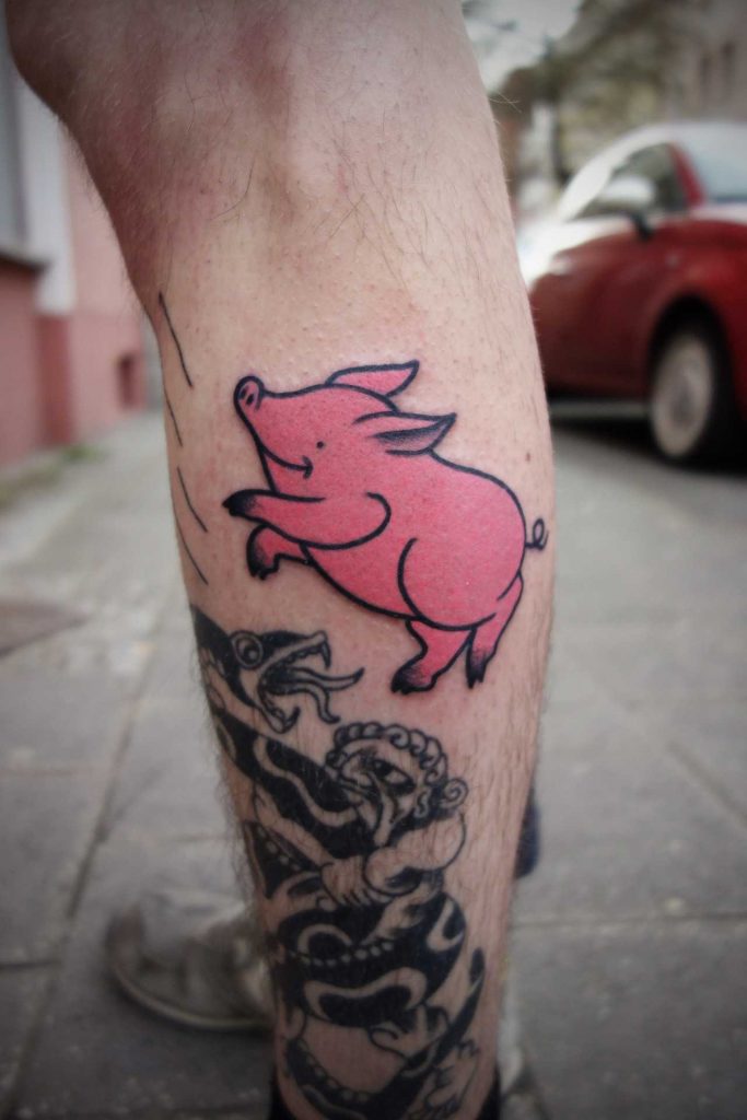 Happy jumping pig tattoo 