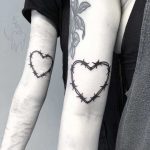 Heart-shaped matching wire tattoos