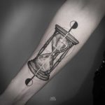 Hourglass and two moons tattoo