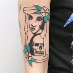 Hourglass with face and skull