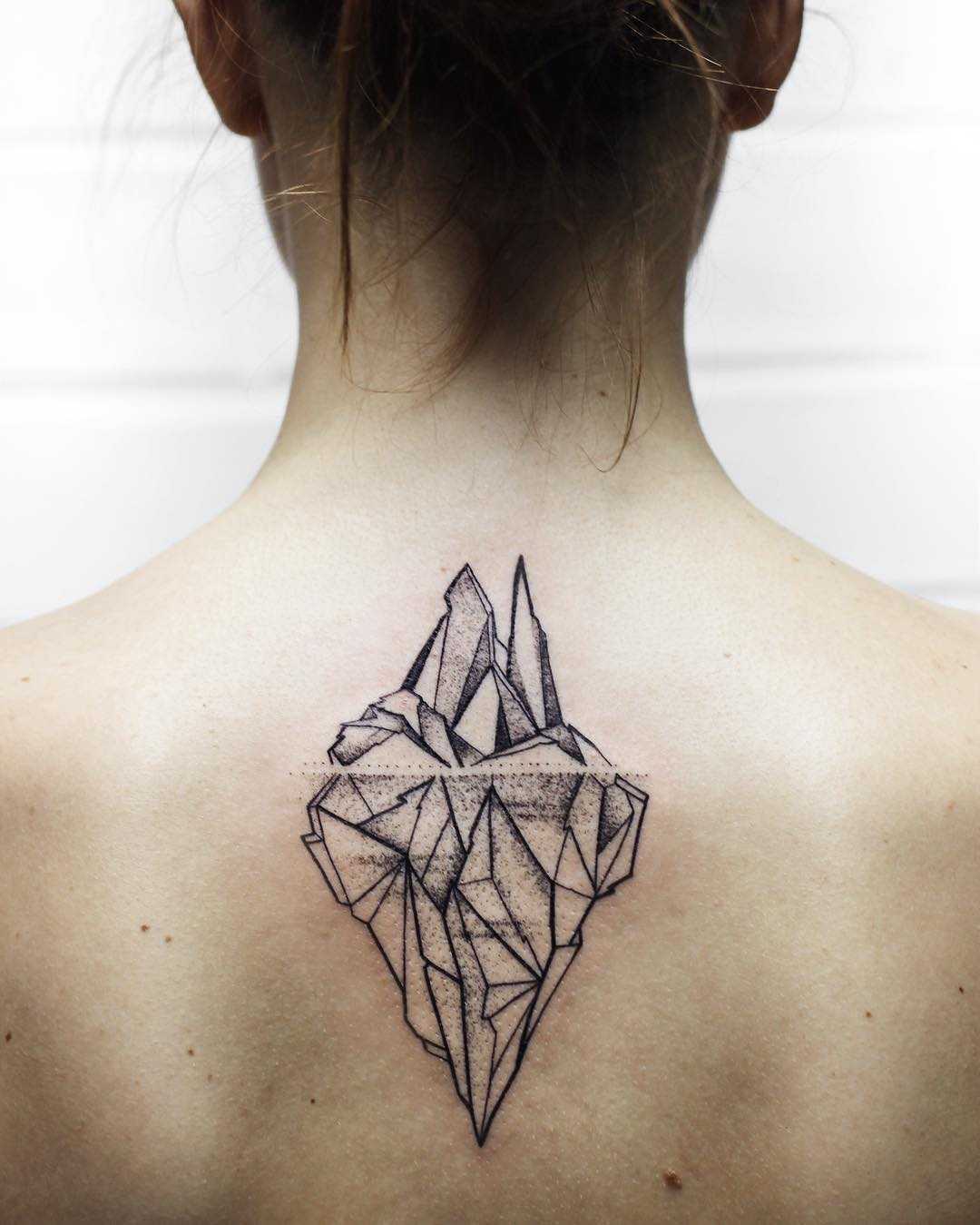 Iceberg tattoo on the upper back