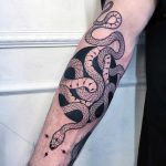 Intertwined snakes tattoo by Mirko Sata