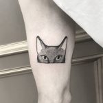 Kitten tattoo on the thigh