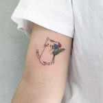 Kitty with flower tattoo