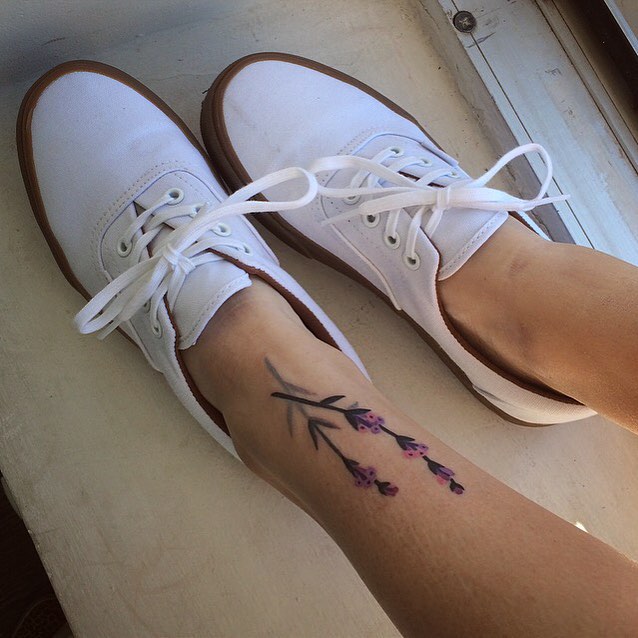 Lavender tattoo on the shin by Sasha Tattooing