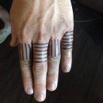 Lines tattoos on fingers