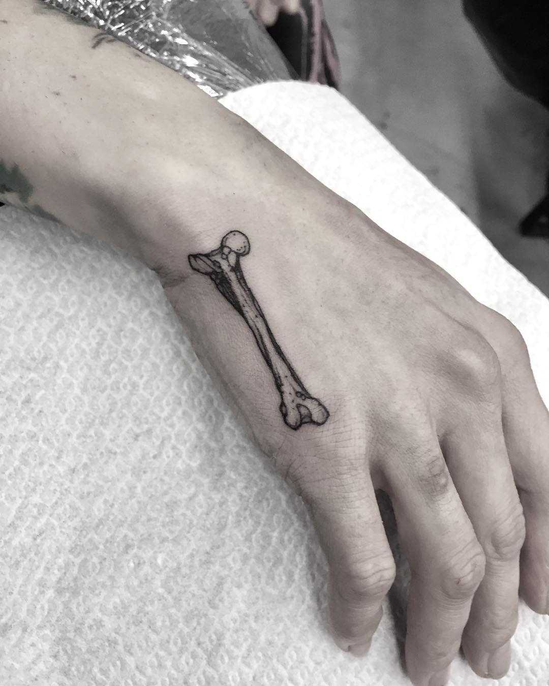 Little bone tattoo on the hand
