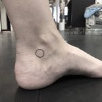 Little circle tattoo on the left ankle