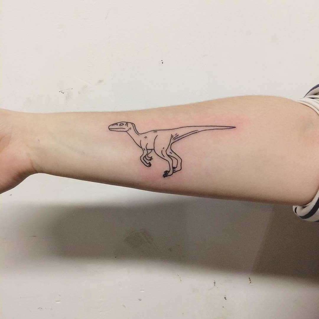 Little dinosaur tattoo on the forearm 