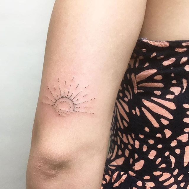 Little sunset tattoo above the elbow