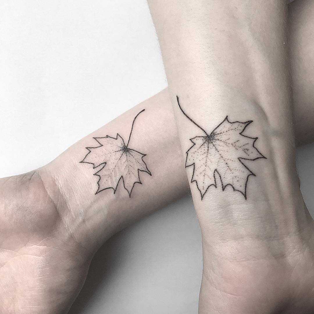 Matching maple leaf tattoos 