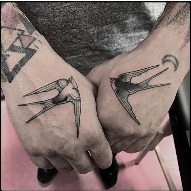 Matching swallow tattoos by Totemica