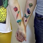 Matching vegetable tattoos for a couple