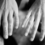 Mini dots tattoos on fingers