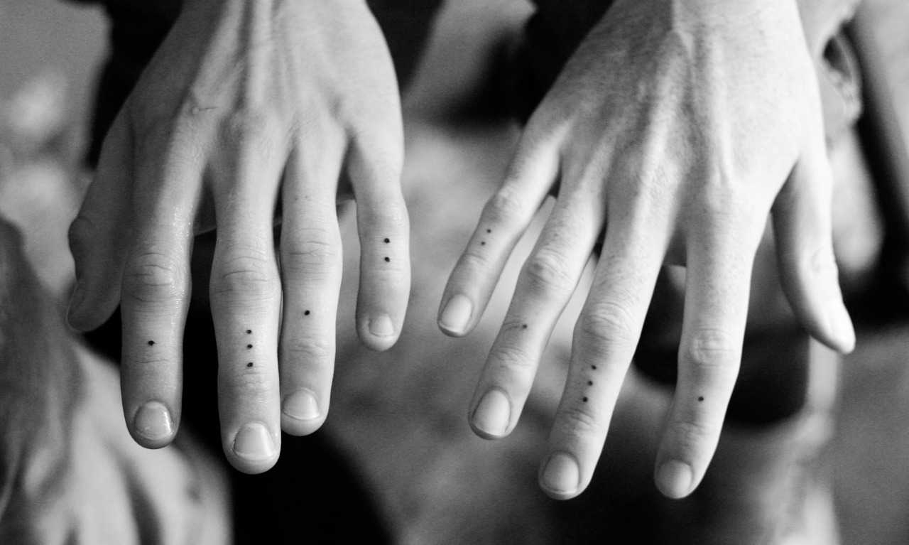Mini dots tattoos on fingers
