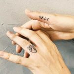 Mini finger tattoos by Cholo