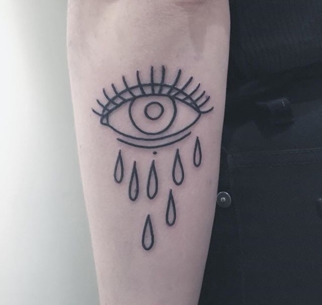 Minimalist crying eye tattoo