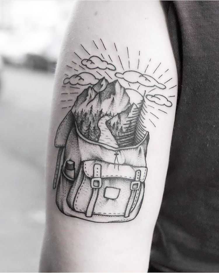 Mountains in a backpack tattoo