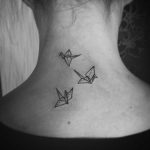 Origami cranes on the back of the neck