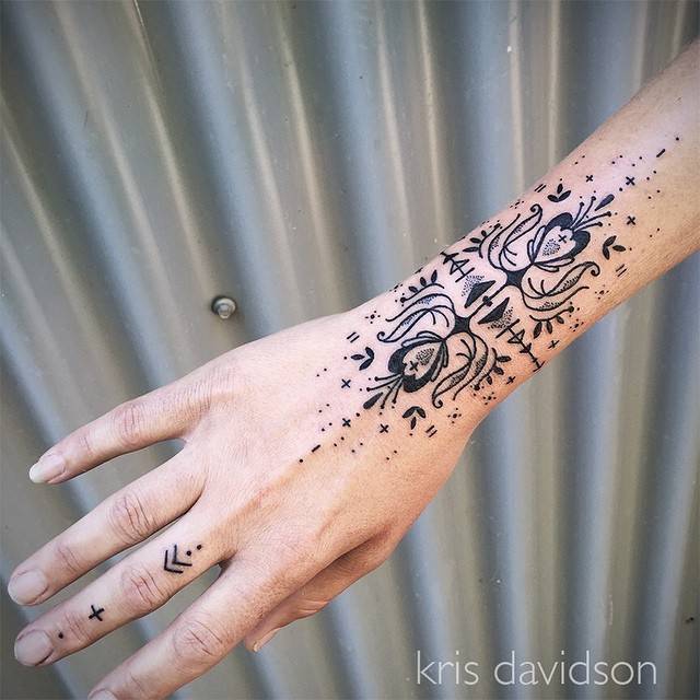 Ornamental wrist tattoo by Kris Davidson