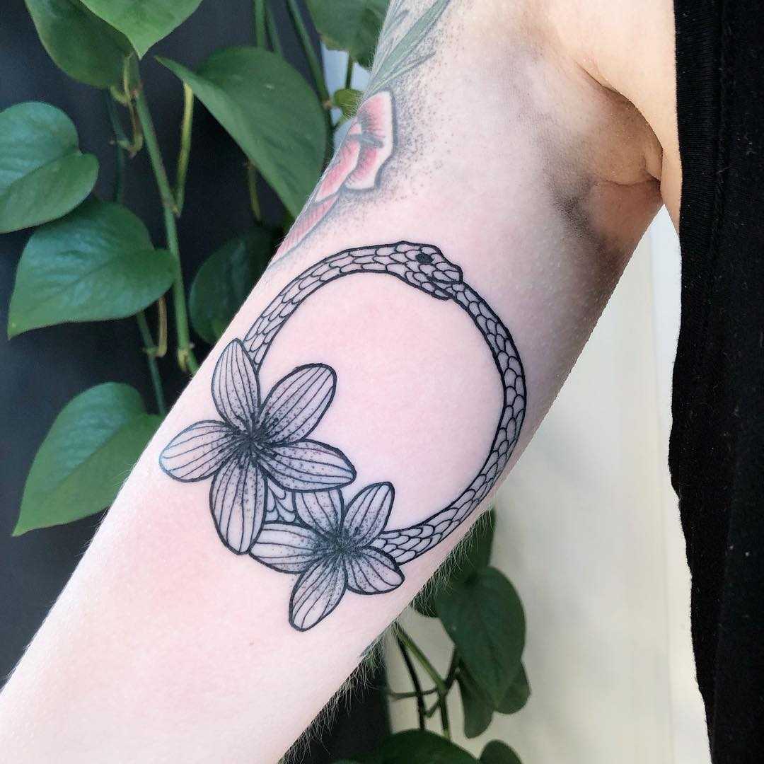 Ouroboros and flowers on the right arm