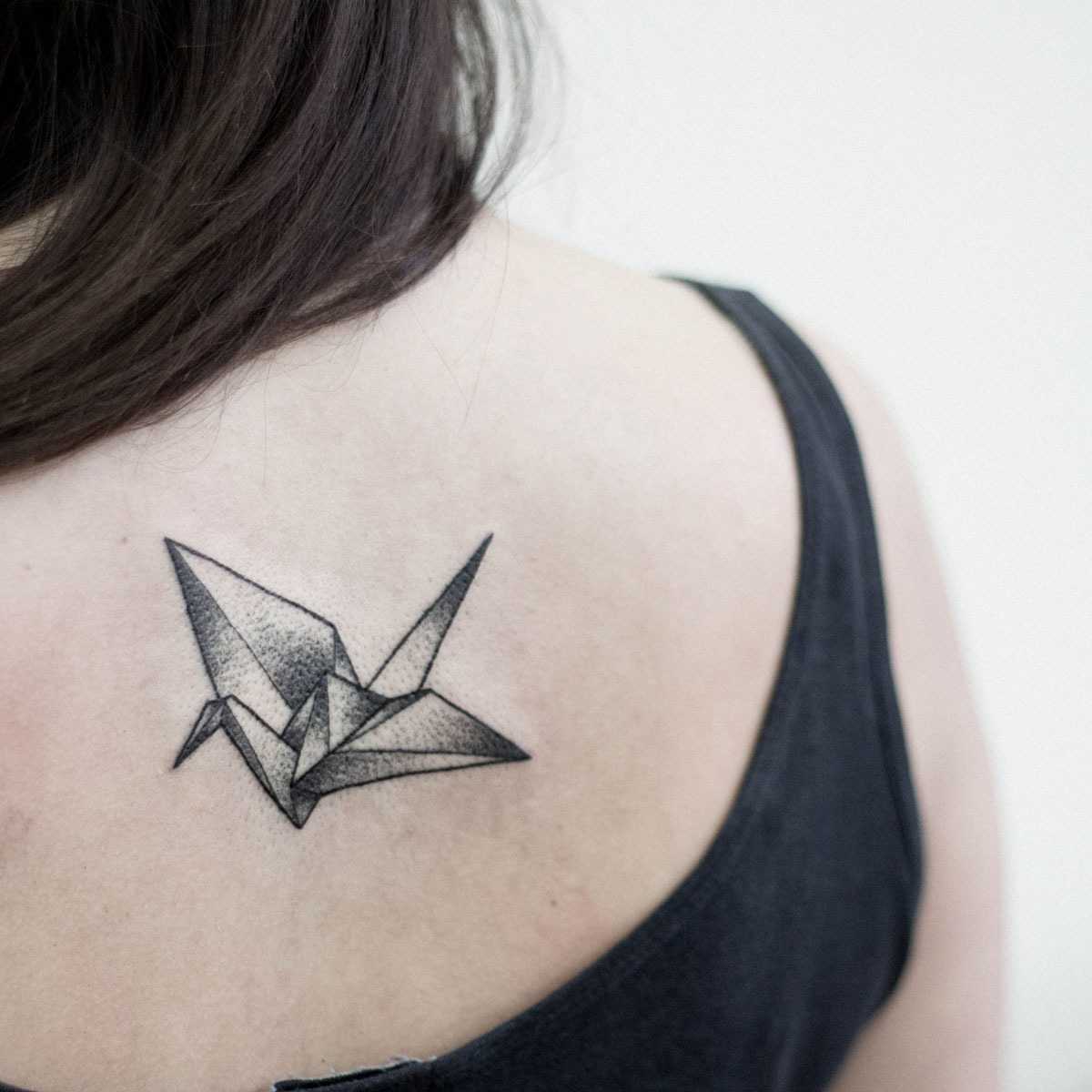 Paper crane tattoo by Dogma Noir