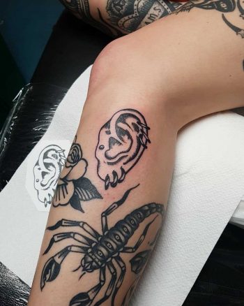 Pierced ear tattoo