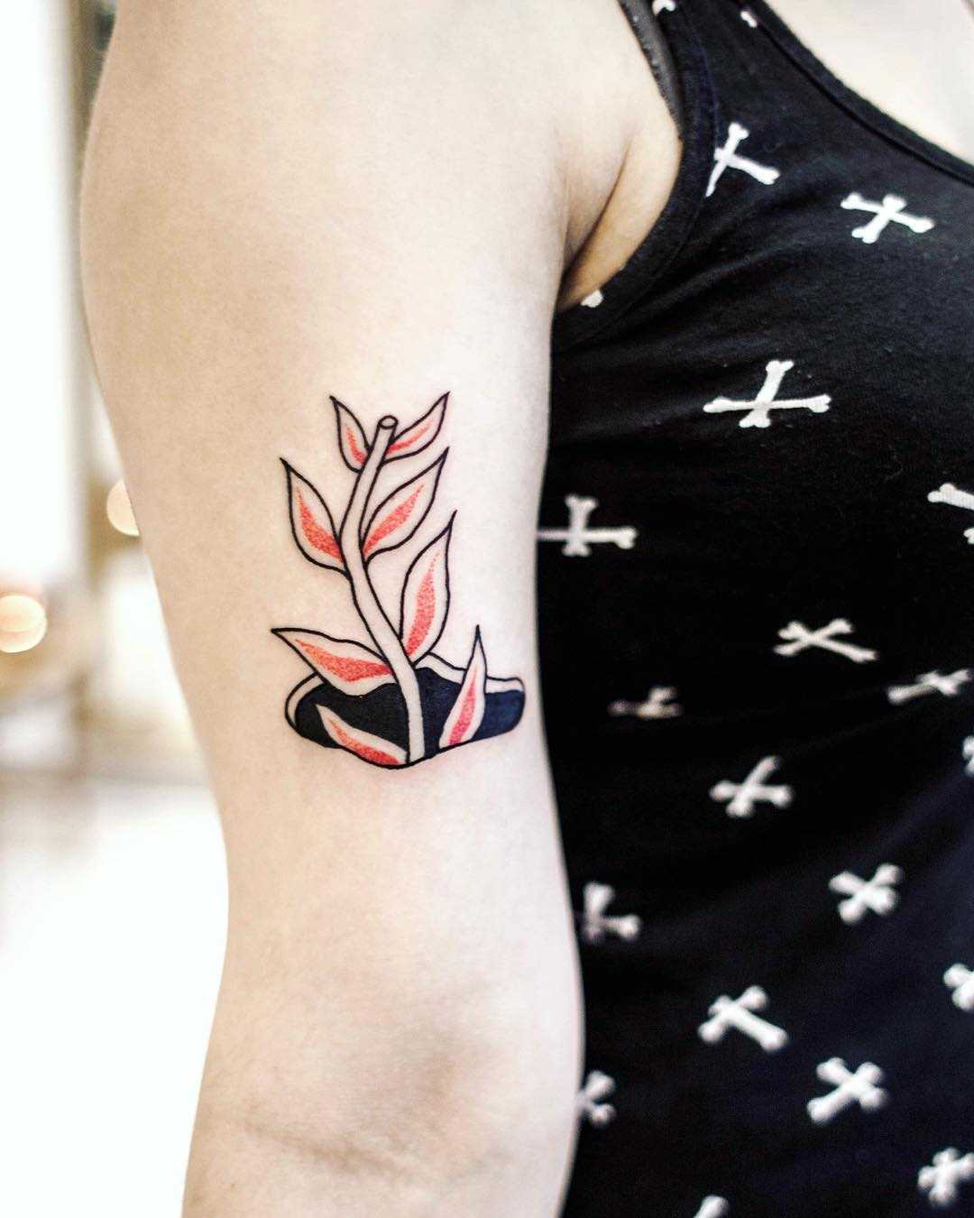 Plant in a hole tattoo