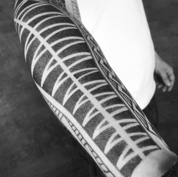 Polynesian style pattern tattoo
