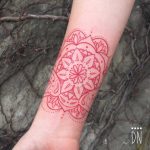 Red infinity mandala tattoo