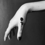 Rose tattoo on a thumb by Berkin Donmezz