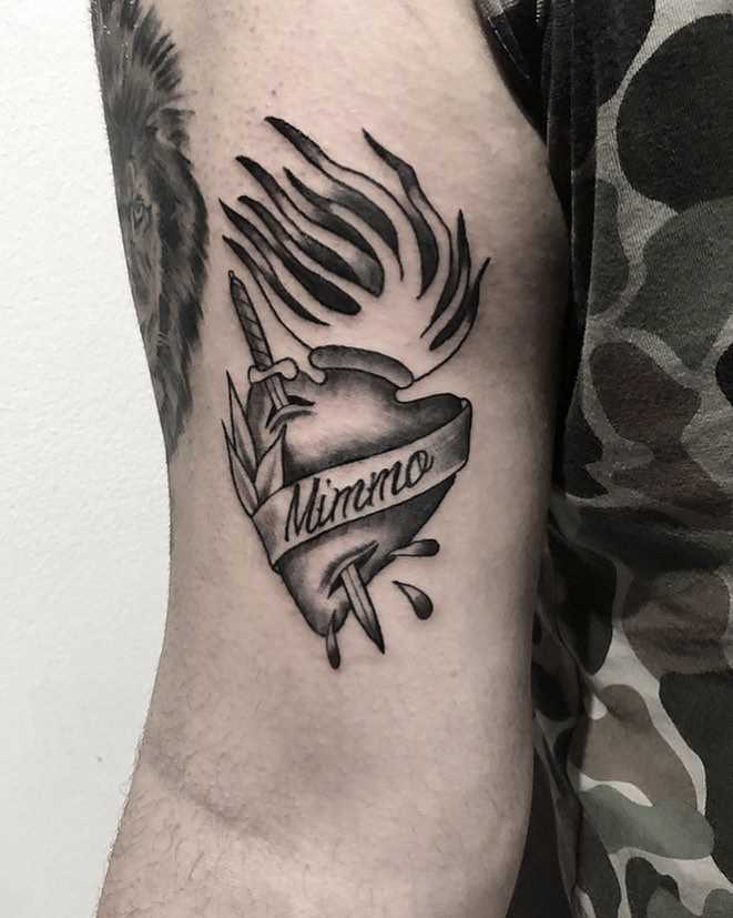 Sacred stabbed heart tattoo