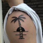 Solid palm tree tattoo done by Twelve Seconds