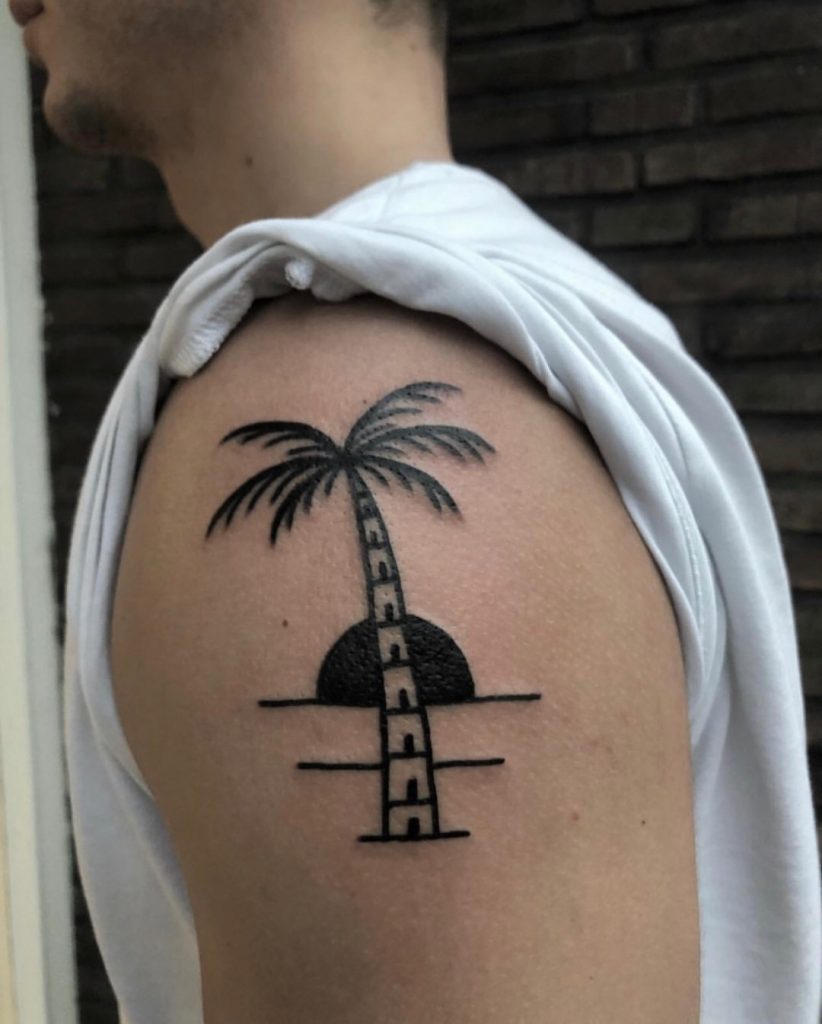 Solid palm tree tattoo done by Twelve Seconds