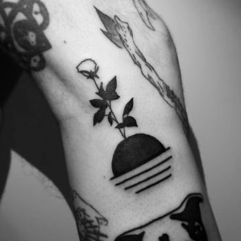 Sunset and rose tattoo