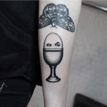 Suspicious egg tattoo by Brendon Welfare Dentist