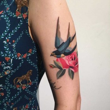 Swallow and flower tattoo