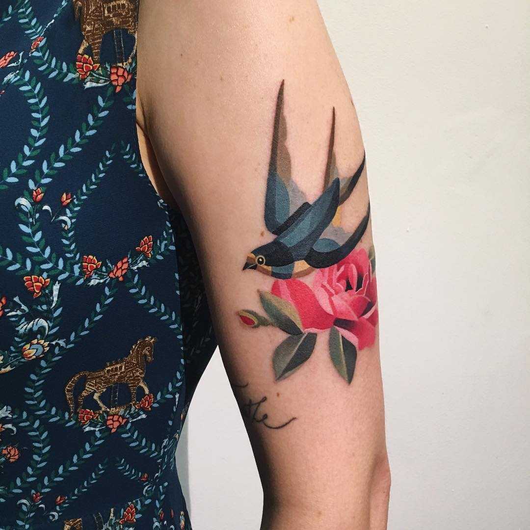 Swallow and flower tattoo
