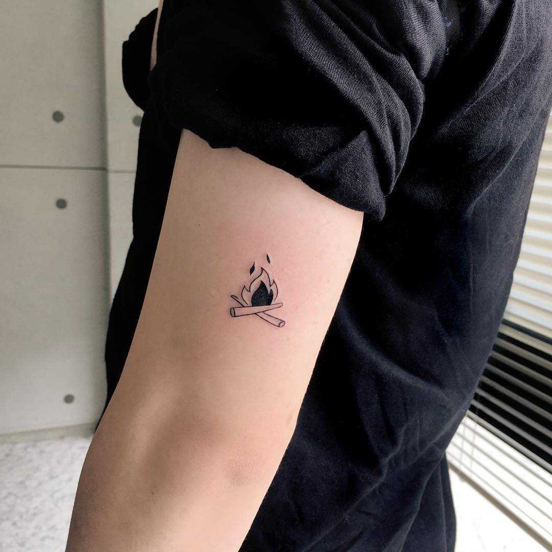 Tiny bonfire tattoo