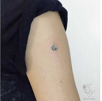 Tiny planet tattoo by Ayhan Krdg