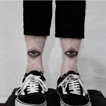 Two eyes on both shins by Jonas Ribeiro