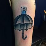 Umbrella and glass tattoo
