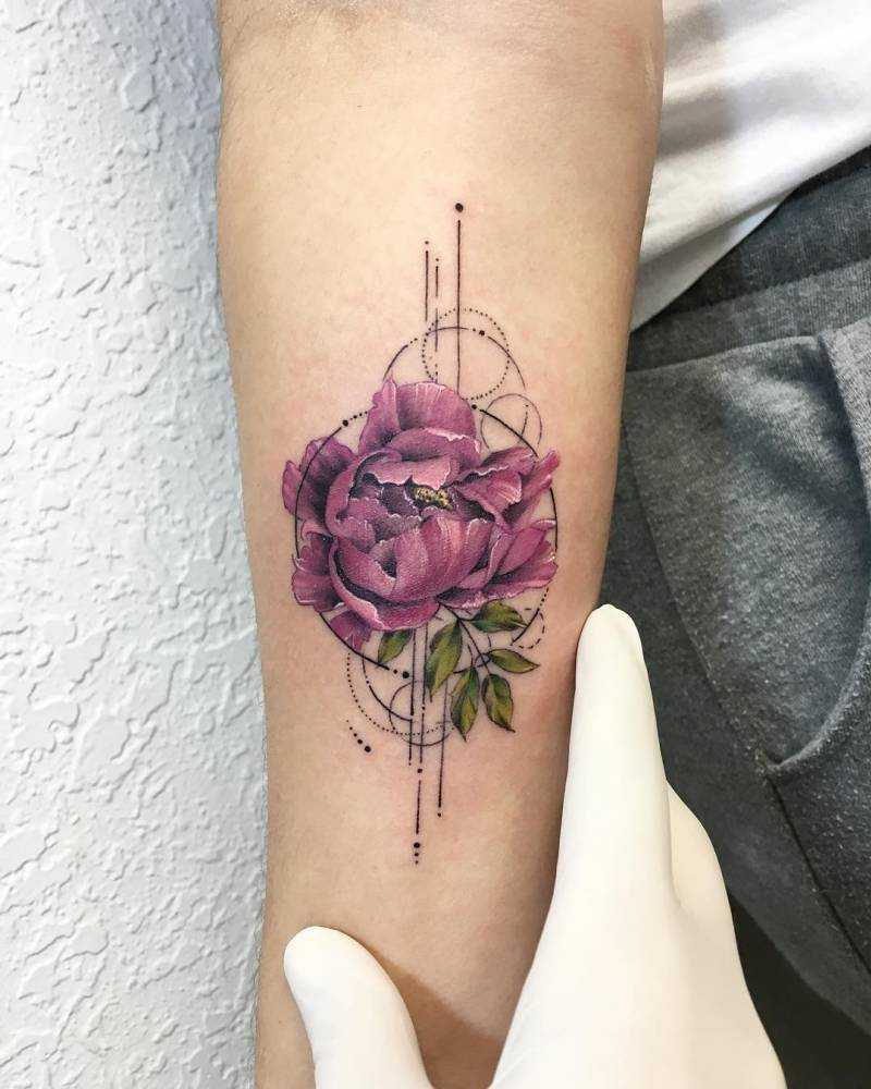 Violet peony tattoo on the forearm