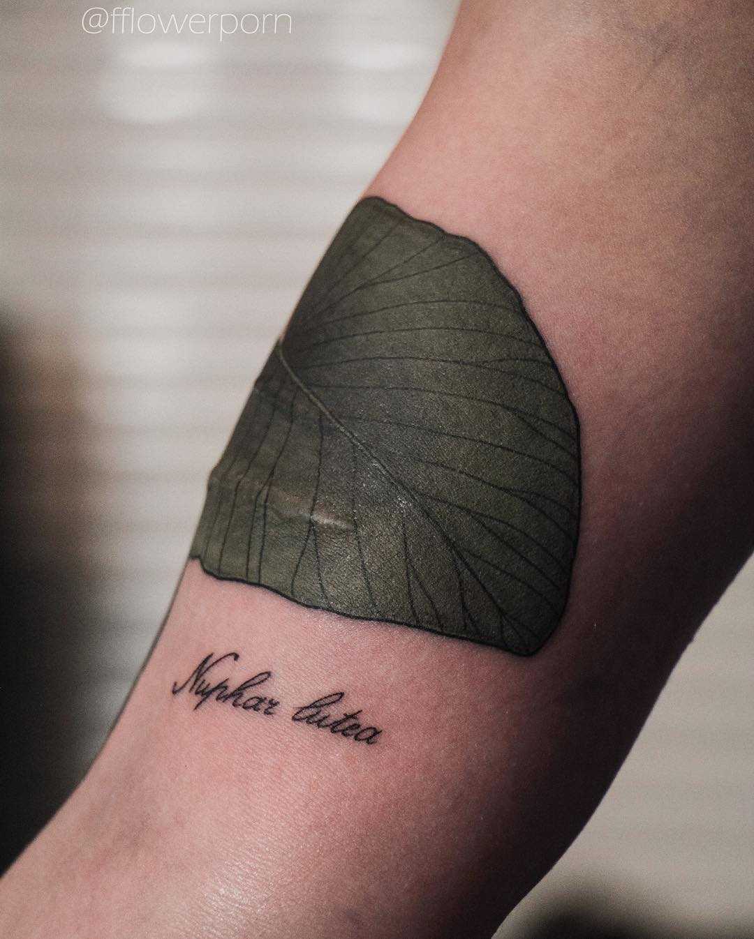 Yellow water lily leaf tattoo
