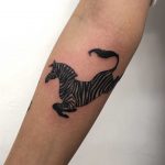 Zebra tattoo on the forearm