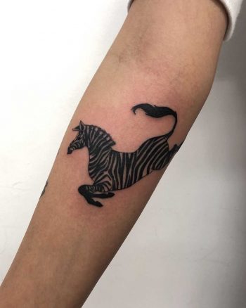 Zebra tattoo on the forearm