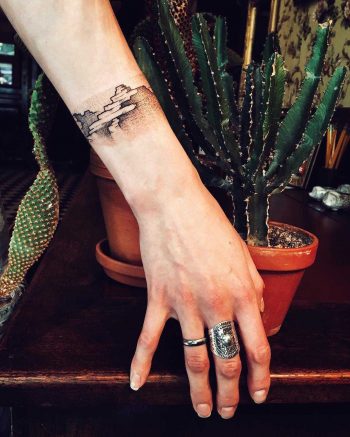 Abstract mountain scenery tattoo