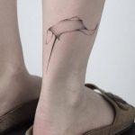 Abstract tattoo on the right calf by Lara M J